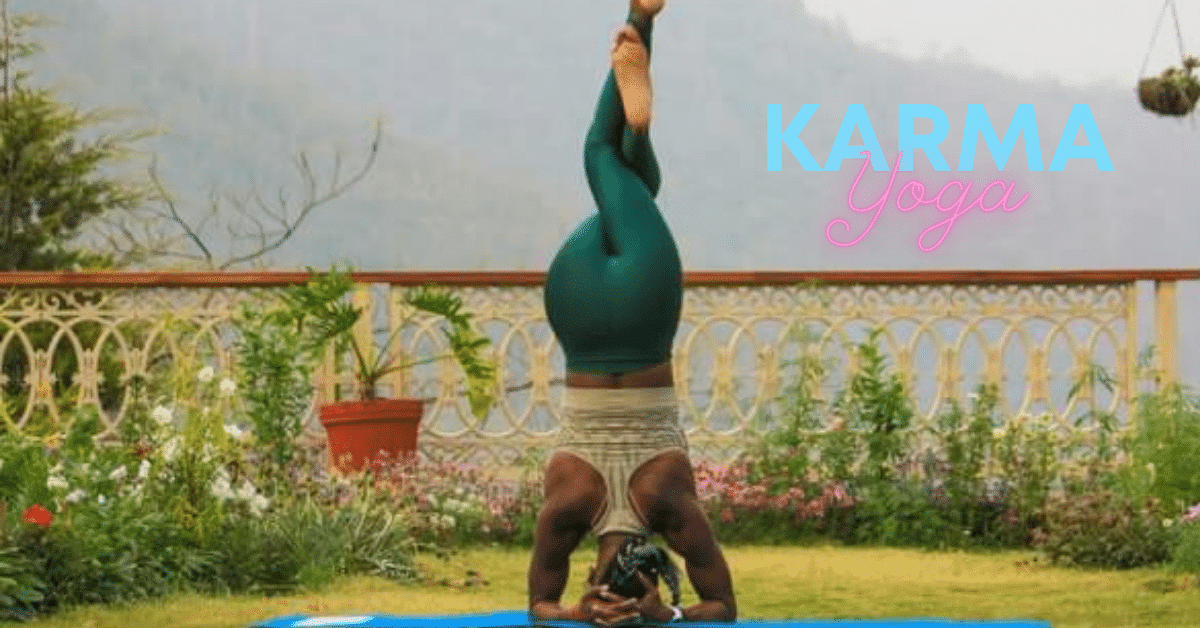 woman wearing green yoga pants doing a yoga head stand.