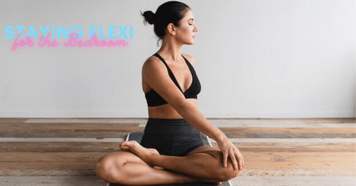 A woman wearing yoga shorts, sitting cross legged is practicing a Tantrc yoga routine.