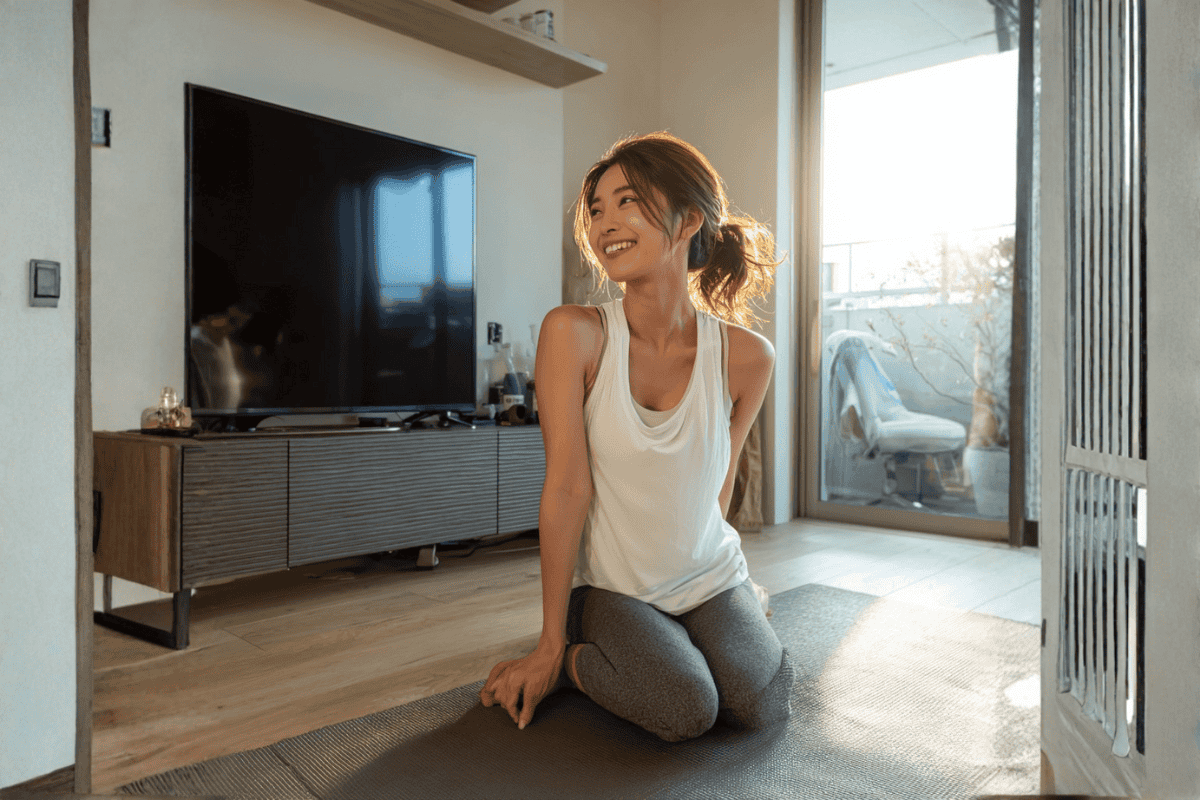 Woman doing yoga at home a good looking woman wearing yoga pants doing yoga at home